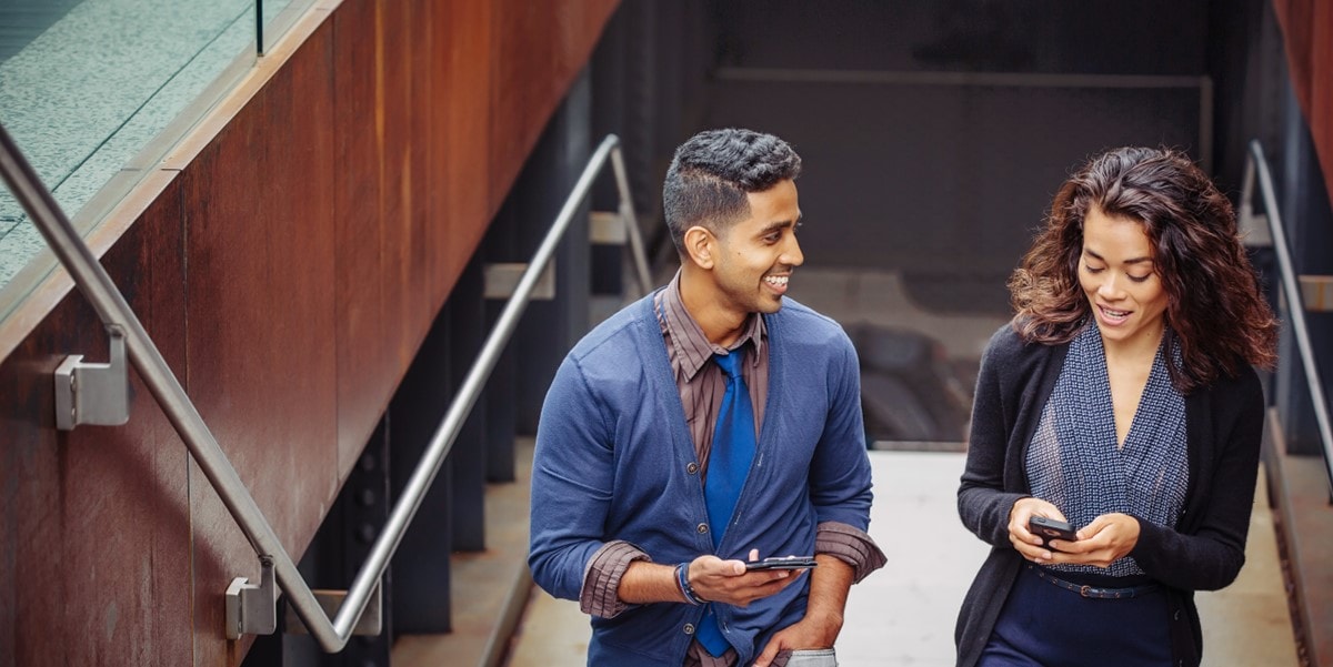 two people walking up stairs