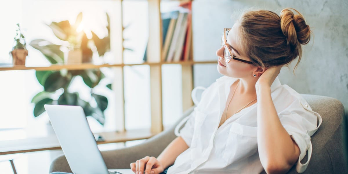 Woman sitting in front of laptop